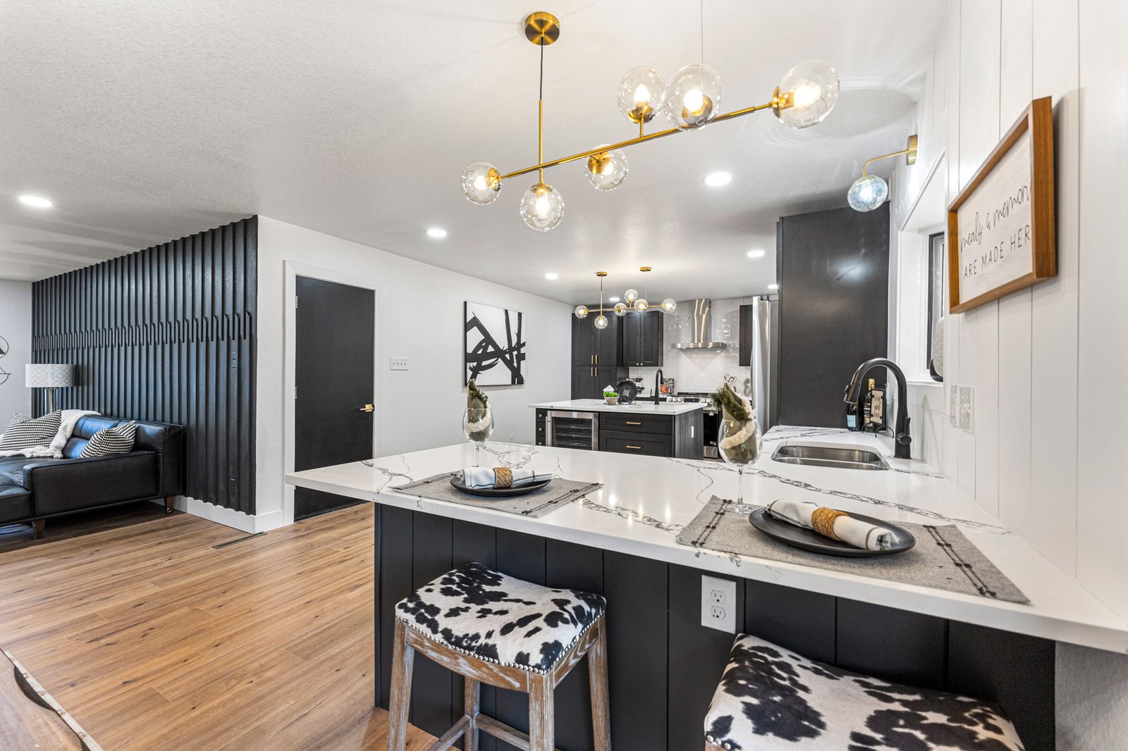 Remodeled kitchen with dark cabinets and marble island after renovation in Denver, CO