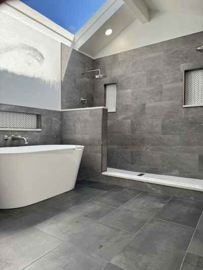 Modern remodeled primary bathroom after renovation in Centennial, CO